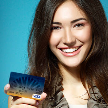 Woman holding a red credit card
