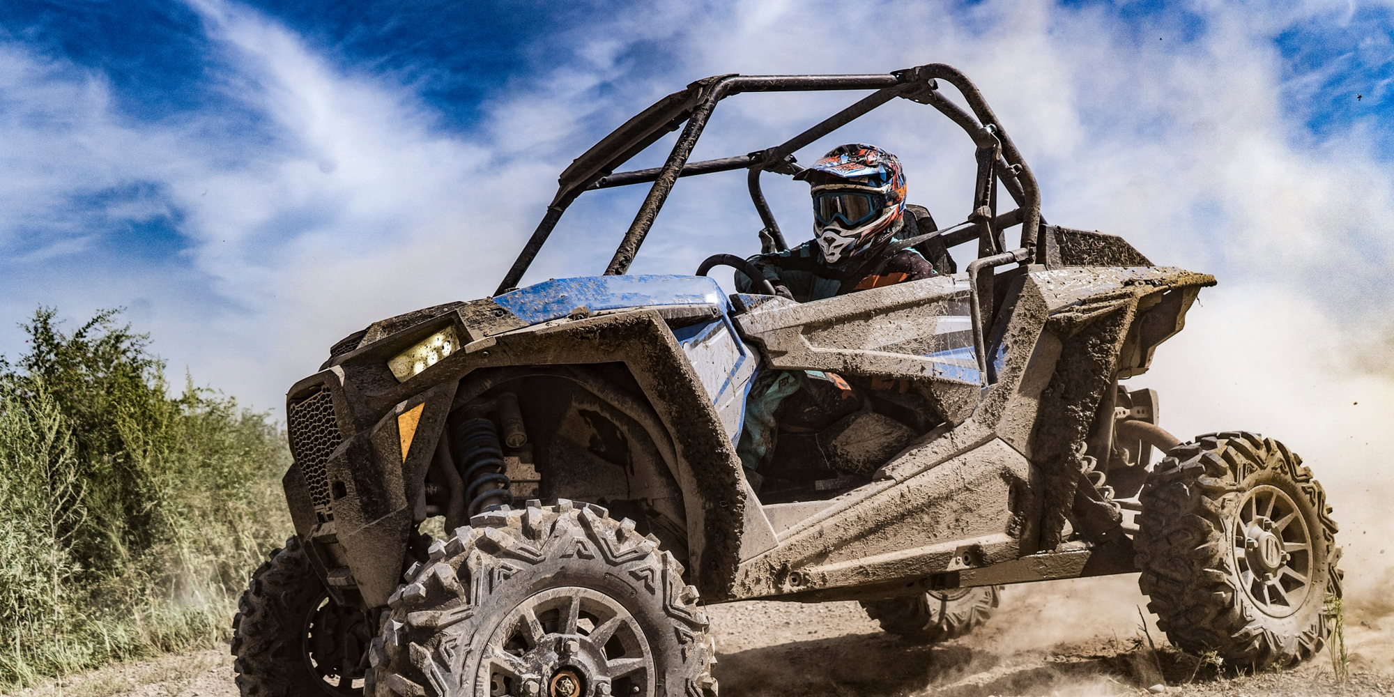 A man driving an ATV