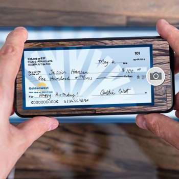 A phone taking a picture of a check