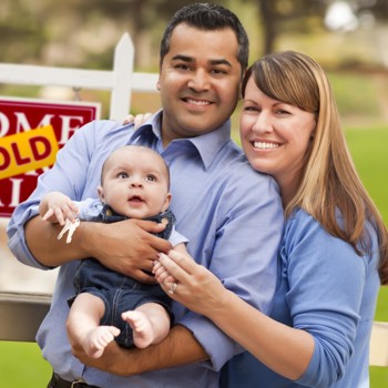 Young family celebrating the purchase of their first home.